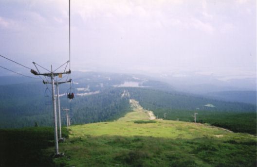 View of Štrbské Pleso from chairlift at Chata pod Soliskom